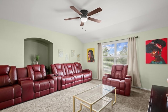 living room featuring carpet flooring, baseboards, lofted ceiling, and ceiling fan