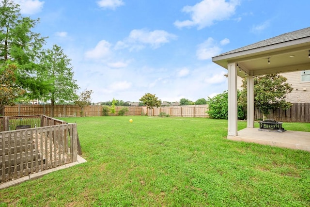 view of yard with a fenced backyard and a patio