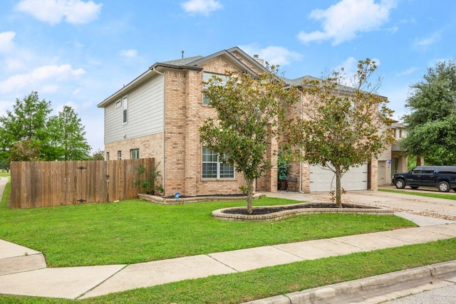 view of front of property featuring fence, a front yard, brick siding, and driveway