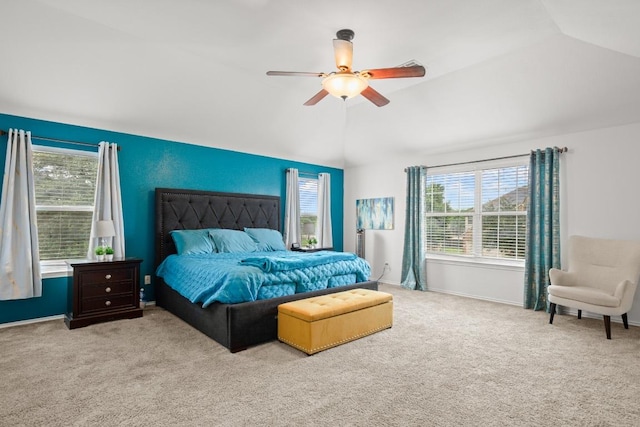 bedroom with carpet, baseboards, lofted ceiling, and ceiling fan