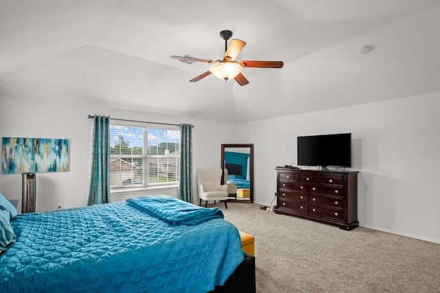 bedroom featuring baseboards, ceiling fan, carpet floors, and vaulted ceiling