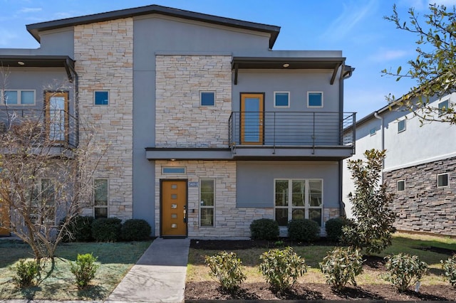 5809 Charles Merle Dr Unit B, Austin, TX 78747 - contemporary home featuring a balcony, stone siding, and stucco siding
