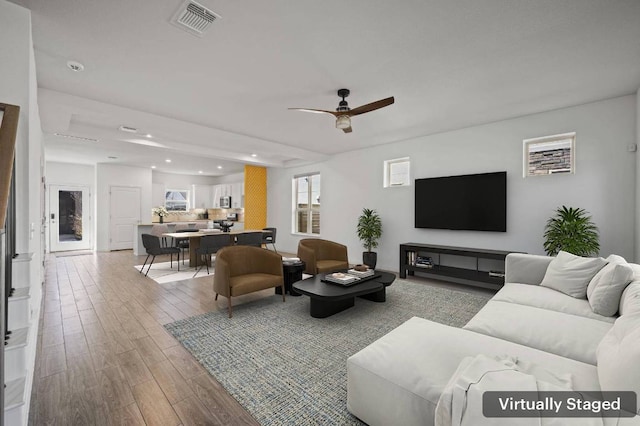 5809 Charles Merle Dr Unit B, Austin, TX 78747 - living area with wood finished floors, recessed lighting, and ceiling fan