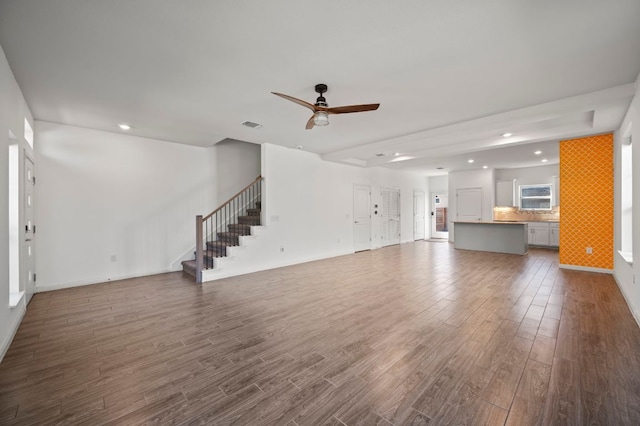 5809 Charles Merle Dr Unit B, Austin, TX 78747 - unfurnished living room with dark wood-style floors, a ceiling fan, stairway, baseboards, and recessed lighting