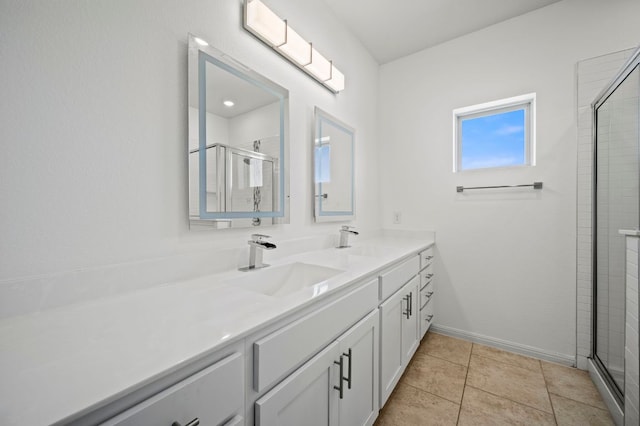5809 Charles Merle Dr Unit B, Austin, TX 78747 - bathroom featuring double vanity, a shower stall, baseboards, and tile patterned flooring