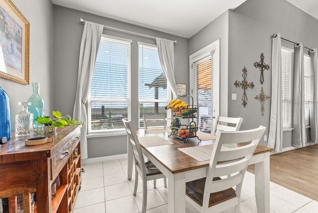 386 Nautical Loop, Kyle, TX 78640 - dining area with healthy amount of natural light, baseboards, and light tile patterned floors