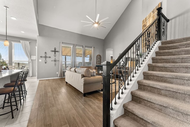 386 Nautical Loop, Kyle, TX 78640 - living room with ceiling fan, stairway, recessed lighting, high vaulted ceiling, and light wood-type flooring