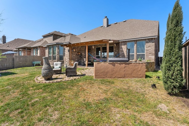 386 Nautical Loop, Kyle, TX 78640 - back of property with brick siding, a patio area, and a chimney