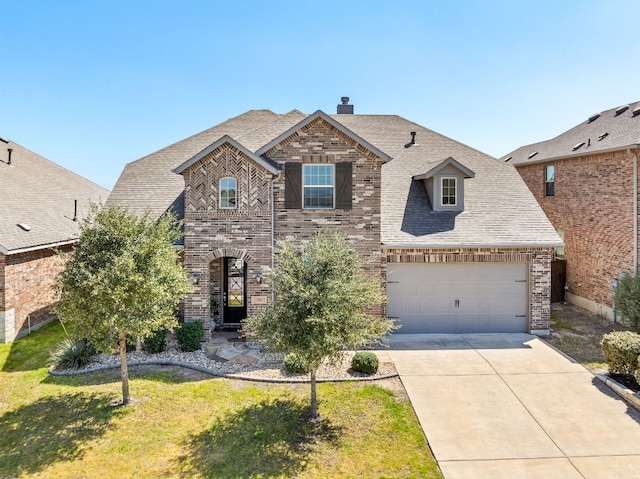 386 Nautical Loop, Kyle, TX 78640 - view of front of property featuring brick siding, concrete driveway, a garage, and a front yard