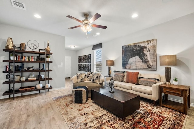 living area with wood finished floors, recessed lighting, a ceiling fan, and visible vents