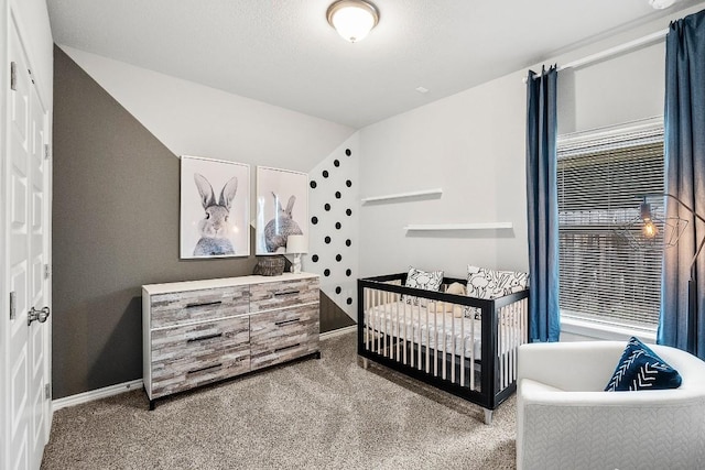 1405 Ambler Dr, Austin, TX 78753 - bedroom featuring carpet floors, lofted ceiling, and a nursery area
