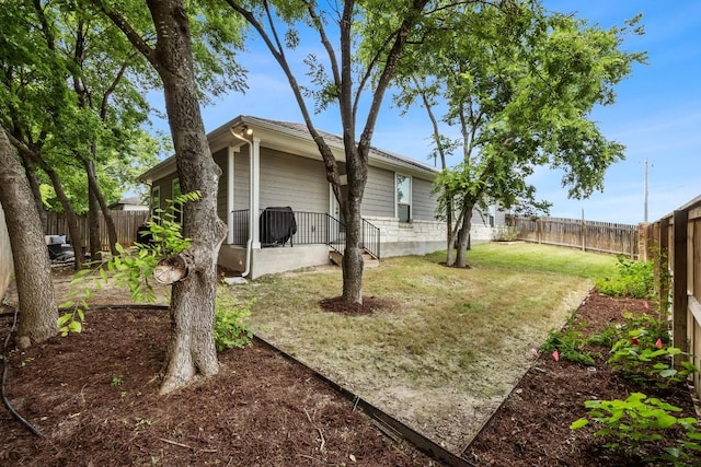 view of yard featuring a fenced backyard