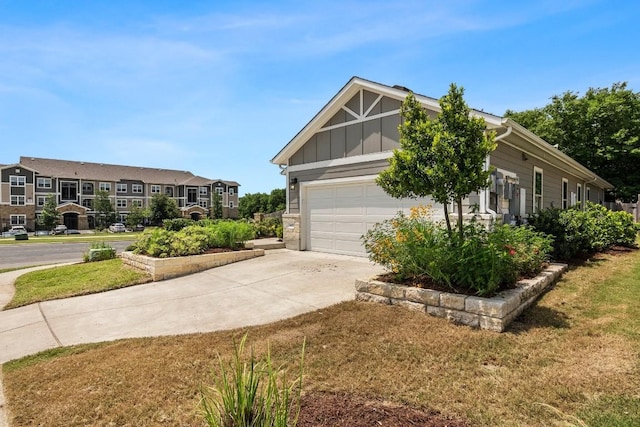 view of front of home featuring an attached garage, board and batten siding, and driveway