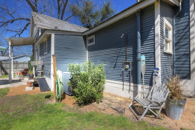 view of home's exterior featuring fence