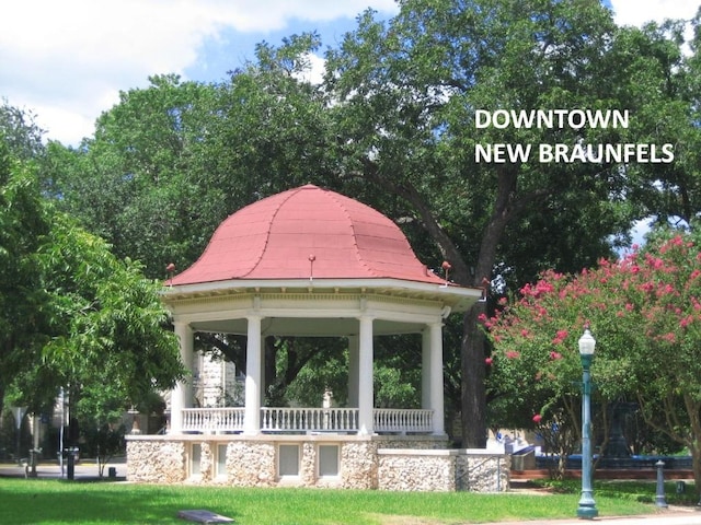 view of property's community featuring a gazebo and a lawn