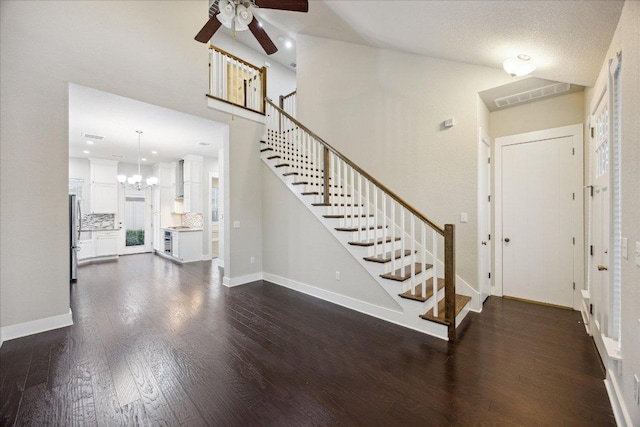 7508 Pantherpaw St, Austin, TX 78757 - foyer featuring a ceiling fan, dark wood-style flooring, stairs, a chandelier, and recessed lighting