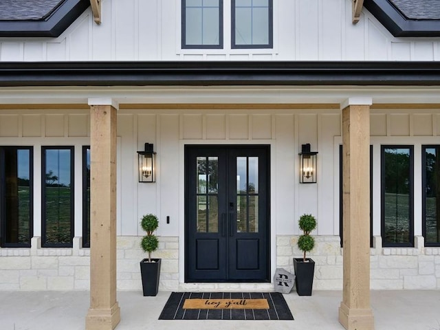 871 Blackbuck Ridge Dr, Lampasas, TX 76550 - property entrance featuring french doors, board and batten siding, and stone siding