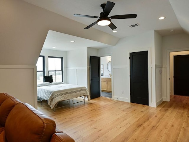 871 Blackbuck Ridge Dr, Lampasas, TX 76550 - bedroom featuring a wainscoted wall, visible vents, light wood finished floors, recessed lighting, and vaulted ceiling