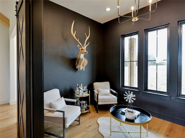 871 Blackbuck Ridge Dr, Lampasas, TX 76550 - living area featuring recessed lighting, baseboards, an inviting chandelier, and wood finished floors