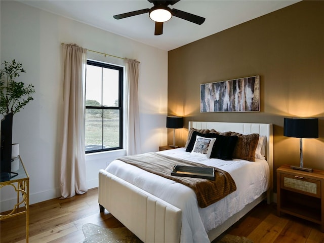 871 Blackbuck Ridge Dr, Lampasas, TX 76550 - bedroom with baseboards, hardwood / wood-style floors, and a ceiling fan
