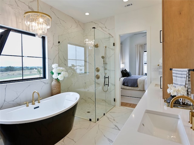 871 Blackbuck Ridge Dr, Lampasas, TX 76550 - bathroom with stone wall, connected bathroom, marble finish floor, and a sink
