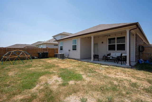 321 Cherry Laurel Ln, Kyle, TX 78640 - rear view of house with a yard, a patio, central AC unit, and a fenced backyard