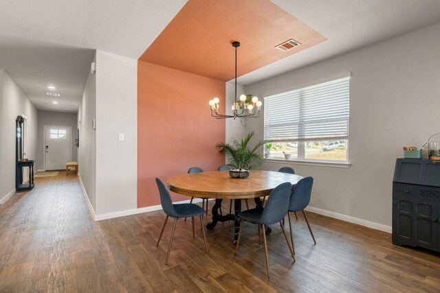 321 Cherry Laurel Ln, Kyle, TX 78640 - dining area featuring baseboards, wood finished floors, and visible vents