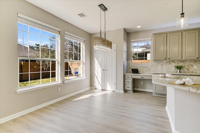 9201 Cessna Ln, Austin, TX 78717 - kitchen featuring light countertops, light wood finished floors, backsplash, and recessed lighting