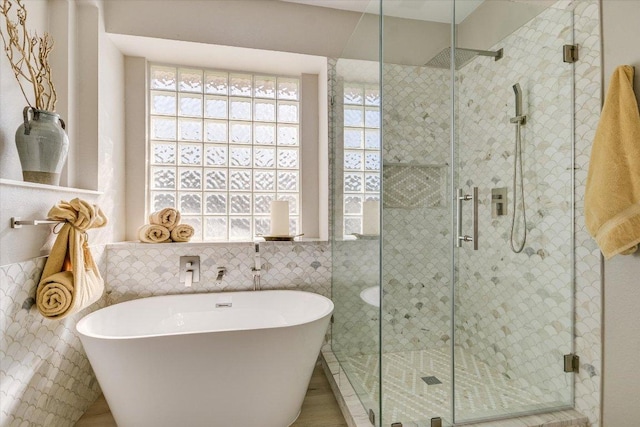 9201 Cessna Ln, Austin, TX 78717 - full bath featuring a freestanding bath, tile walls, and a stall shower