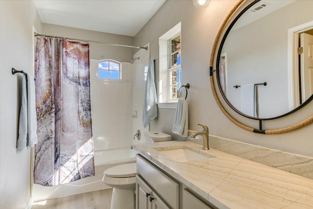 9201 Cessna Ln, Austin, TX 78717 - bathroom featuring toilet, shower / tub combo, vanity, and wood finished floors