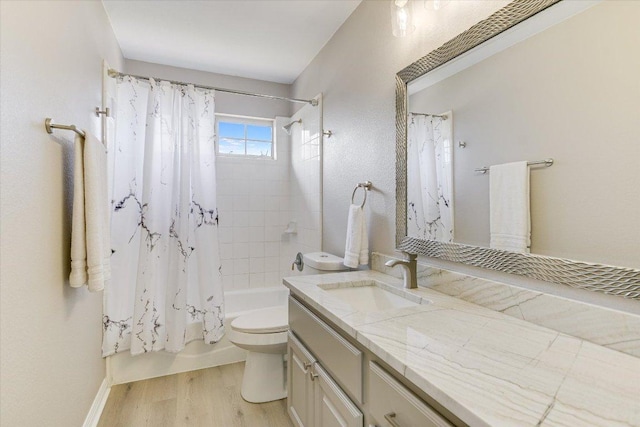 9201 Cessna Ln, Austin, TX 78717 - bathroom featuring vanity, wood finished floors, shower / bath combo, and toilet