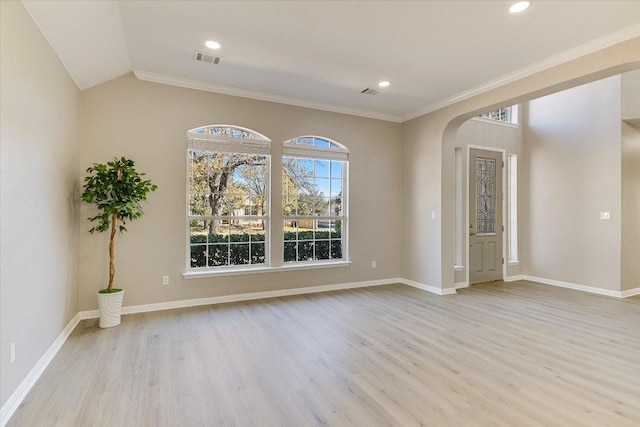 9201 Cessna Ln, Austin, TX 78717 - empty room featuring arched walkways, wood finished floors, baseboards, ornamental molding, and recessed lighting