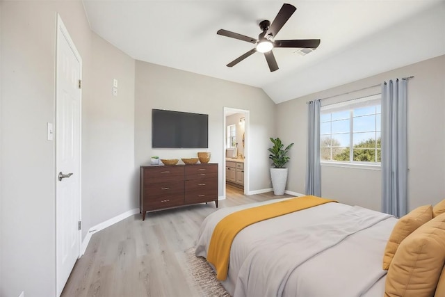 9201 Cessna Ln, Austin, TX 78717 - bedroom with light wood finished floors, baseboards, vaulted ceiling, ceiling fan, and ensuite bath