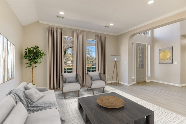 9201 Cessna Ln, Austin, TX 78717 - living area with arched walkways, light wood-type flooring, baseboards, crown molding, and recessed lighting