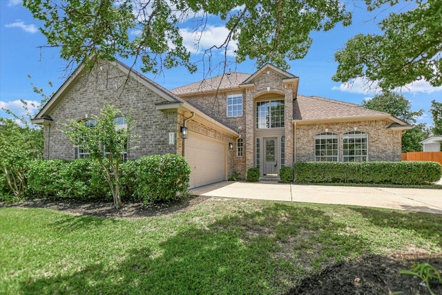 9201 Cessna Ln, Austin, TX 78717 - traditional home featuring an attached garage, driveway, and brick siding