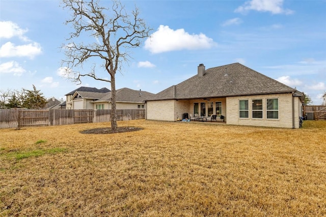 1737 Kerr Valley Ln, College Station, TX 77845 - rear view of property featuring ceiling fan, a patio, and a chimney