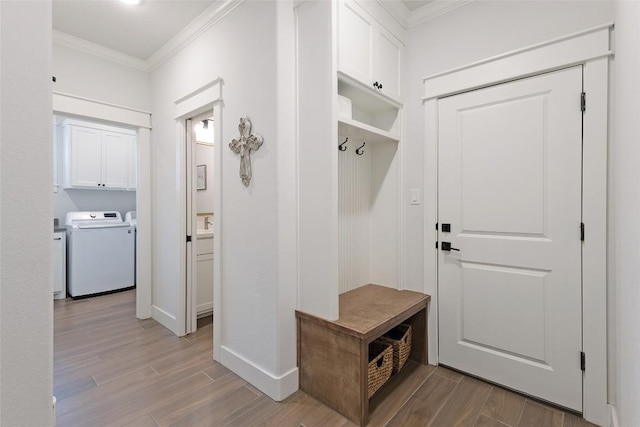 1737 Kerr Valley Ln, College Station, TX 77845 - mudroom with ornamental molding, washer and clothes dryer, wood finished floors, and baseboards