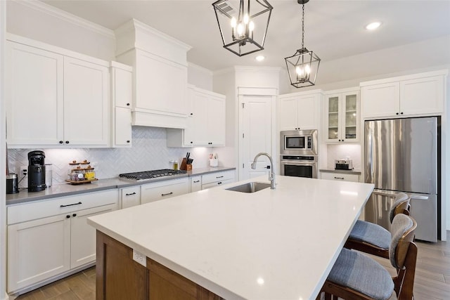 1737 Kerr Valley Ln, College Station, TX 77845 - kitchen featuring appliances with stainless steel finishes, a sink, a chandelier, recessed lighting, and a center island with sink