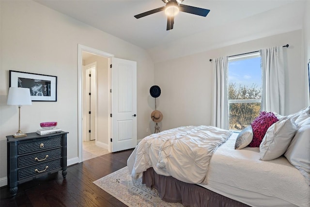 9525 Stratus Dr, Dripping Springs, TX 78620 - bedroom with baseboards, wood finished floors, lofted ceiling, and a ceiling fan