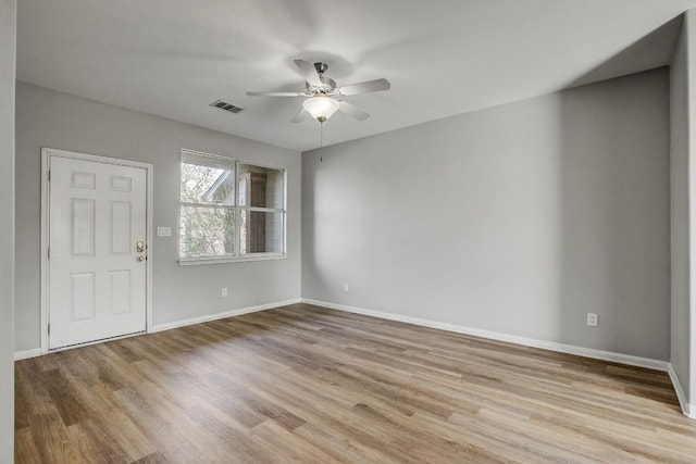 512 Eberhart Ln Unit 1207, Austin, TX 78745 - foyer featuring ceiling fan, wood finished floors, and baseboards