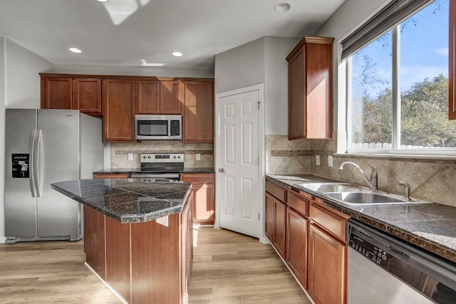 512 Eberhart Ln Unit 1207, Austin, TX 78745 - kitchen with appliances with stainless steel finishes, a sink, healthy amount of natural light, a kitchen island, and recessed lighting