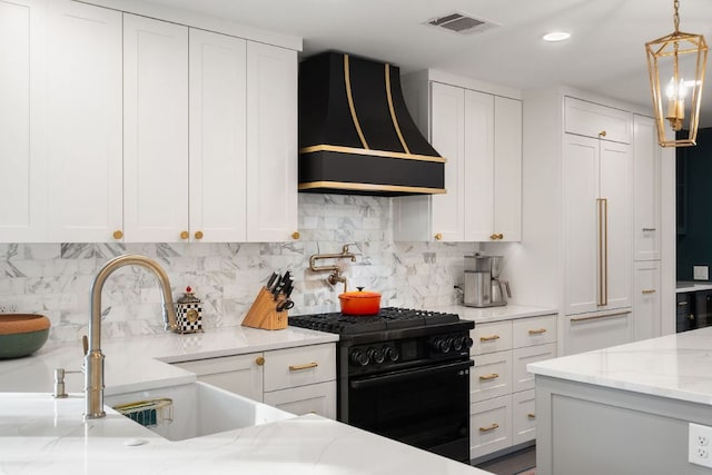 3506 Clearview Dr, Austin, TX 78703 - kitchen featuring black gas stove, wall chimney exhaust hood, white cabinets, decorative backsplash, and recessed lighting