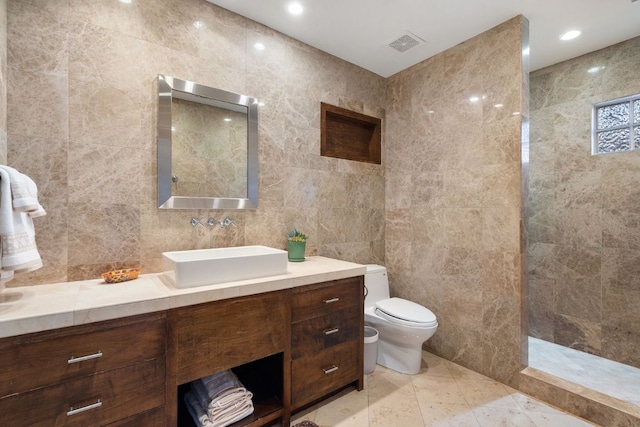 3506 Clearview Dr, Austin, TX 78703 - bathroom with tile walls, vanity, and walk in shower