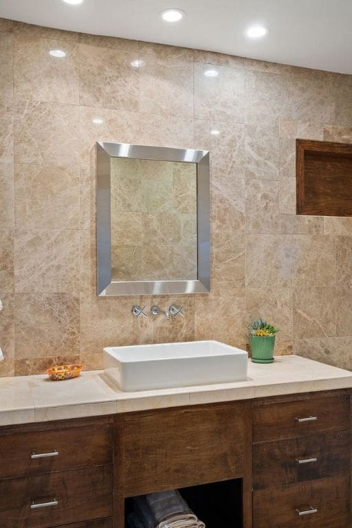 3506 Clearview Dr, Austin, TX 78703 - bathroom with tile walls, vanity, and tasteful backsplash