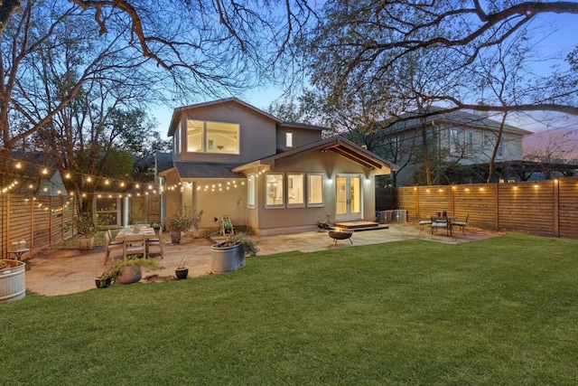 3506 Clearview Dr, Austin, TX 78703 - rear view of house featuring a fenced backyard, stucco siding, french doors, a patio, and roof with shingles