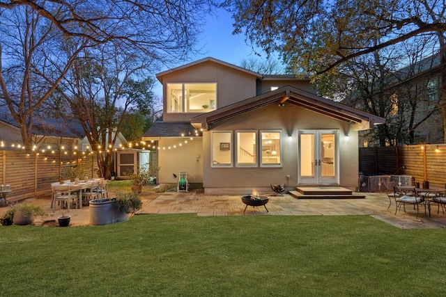 3506 Clearview Dr, Austin, TX 78703 - rear view of house featuring an outdoor fire pit, stucco siding, a patio, a shingled roof, and outdoor dining area