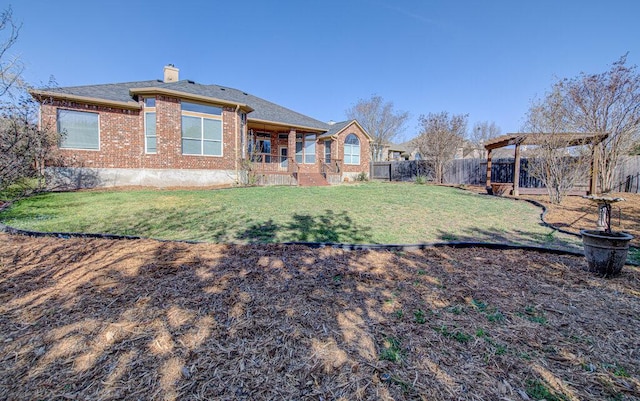 120 Mountain Laurel Way, Austin, TX 78737 - back of house featuring brick siding, a fenced backyard, and a chimney