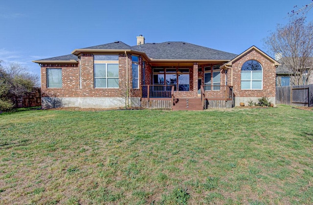 120 Mountain Laurel Way, Austin, TX 78737 - rear view of house featuring brick siding and a chimney