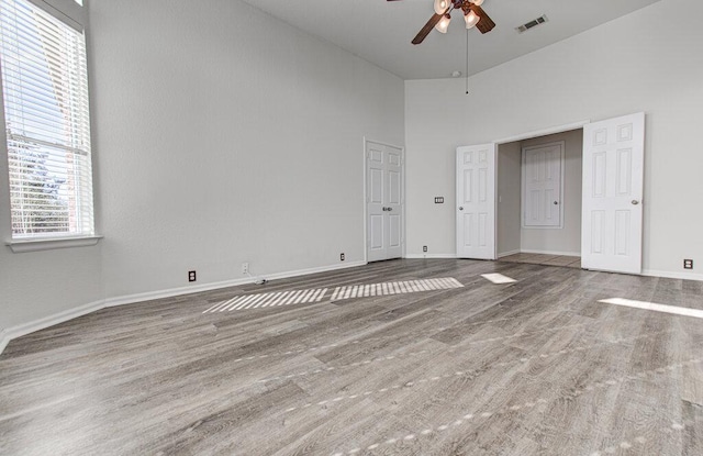 120 Mountain Laurel Way, Austin, TX 78737 - unfurnished bedroom featuring a high ceiling, wood finished floors, and a ceiling fan