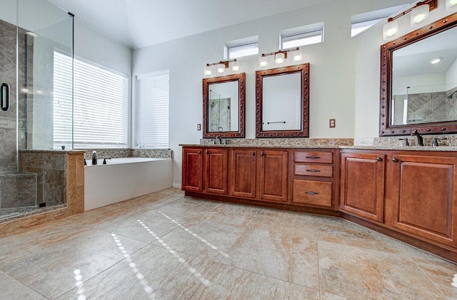 120 Mountain Laurel Way, Austin, TX 78737 - full bath featuring a stall shower, double vanity, a garden tub, and tile patterned flooring
